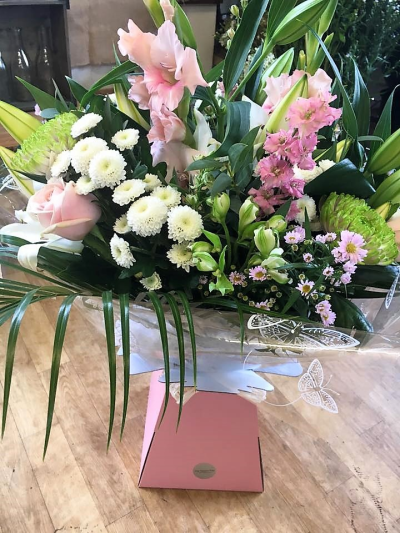 Mellow Pale - Flowers presented in an aqua box. Pale pink flowers, creams and greenery.