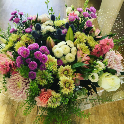 Full Of Wonder - Flowers presented in an aqua box. A Nice colourful mix of flowers in shades of pink, purple, whites and greens.