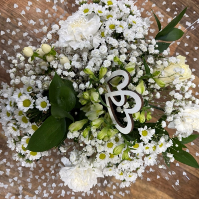 White Valentine’s Mix - Mixed flowers & foliage in white and green to include a single white Rose in the centre.